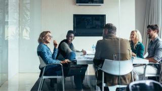Executive Team in Board Room having a Level 10 Meeting